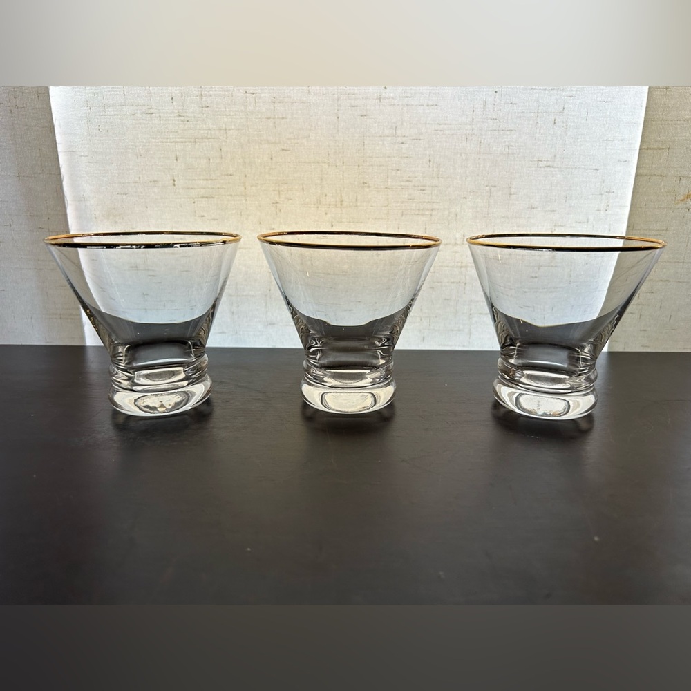 3 stemless Martini/Whisker glasses with gold rims.